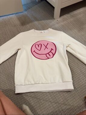 White Sweatshirt with Pink Smiley Face Graphic